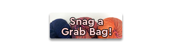 Snag a Grab Bag! text over pink and blue skeins of yarn
