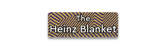 The Heinz Blanket text over a crocheted blanket close up