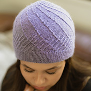 A model wearing a purple knit toque