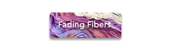 Fading Fibers text over colorful skeins of unraveled yarn