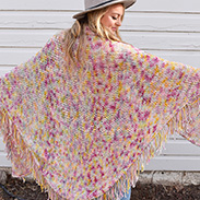 A model wearing a pink textured shawl