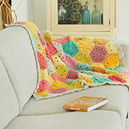A colorful blanket draped over a couch