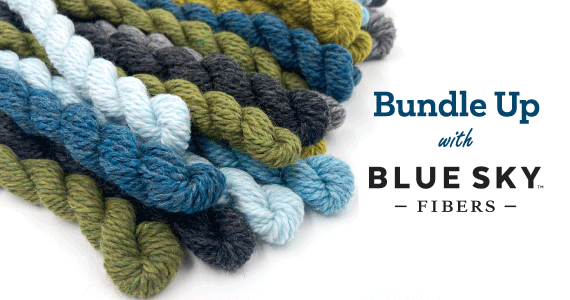 Bundle Up With Blue Sky Fibers with a bundle of green and blue mini skeins of yarn