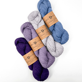 A gif of multiple skeins of colored yarn