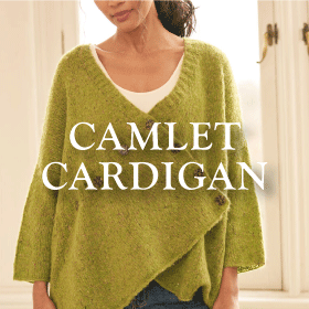 Camlet Cardigan - A model wearing a green knit cardigan