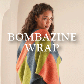 Bombazine Scarf - A model wearing a colorful patchwork shawl