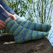 A model wearing blue and green striped socks