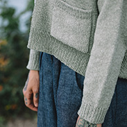 A model wearing a handknit sweater