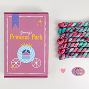 A pink box that says Jimmy's Princess Pack with an illustrated carriage and mini skeins of pinka and green variegated yarn