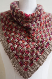 A pink and grey knit cowl on a mannequin